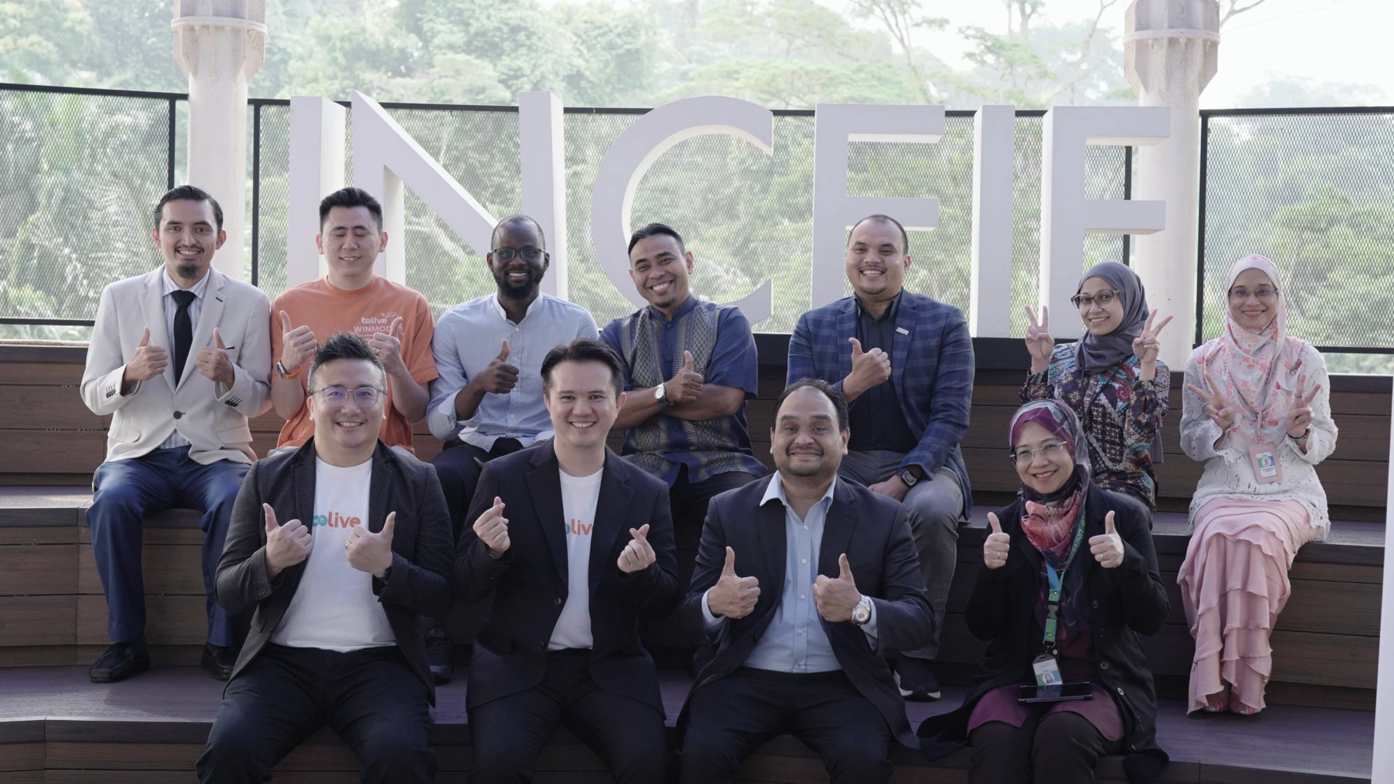 The BeLive and INCEIF University teams together at the INCEIF campus sign