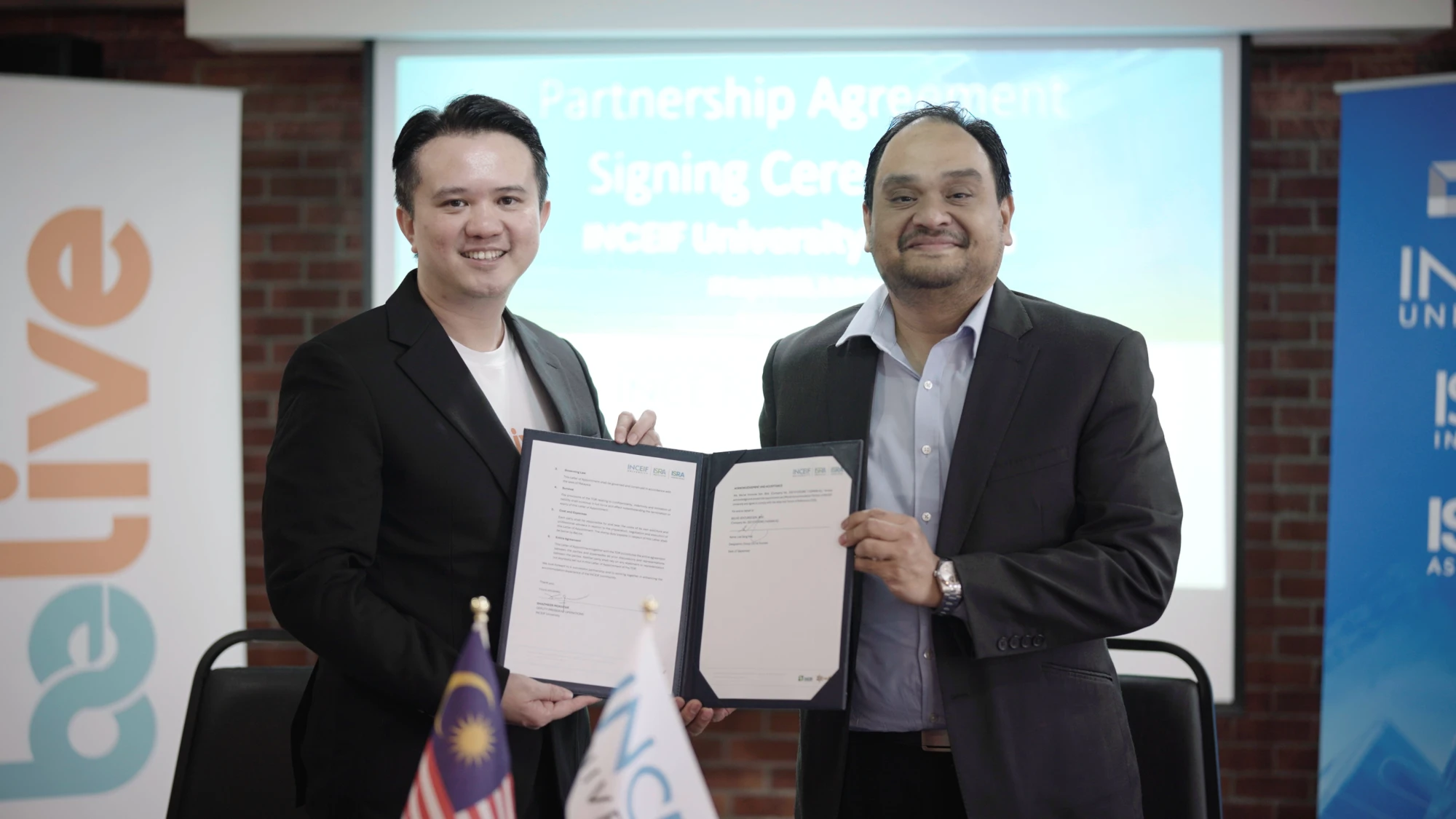 BeLive and INCEIF University representatives holding the signed partnership agreement